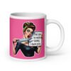White ceramic coffee mug with pink color wrapped around. The mug has a graphic of an angry looking retro woman holding a knife and a sign. The sign says 'Tell me to calm down. I dare you.' The graphic is printed on both sides of the mug.