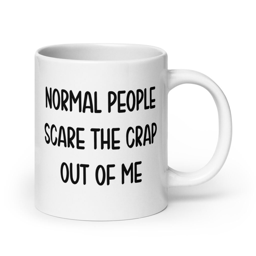 White ceramic coffee mug with the text 'Normal people scare the crap out of me' printed on both sides.