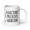 White ceramic coffee mug that has an image of a surgical scalpel and the phrase 'Vasectomy prevents abortion' printed on both sides.