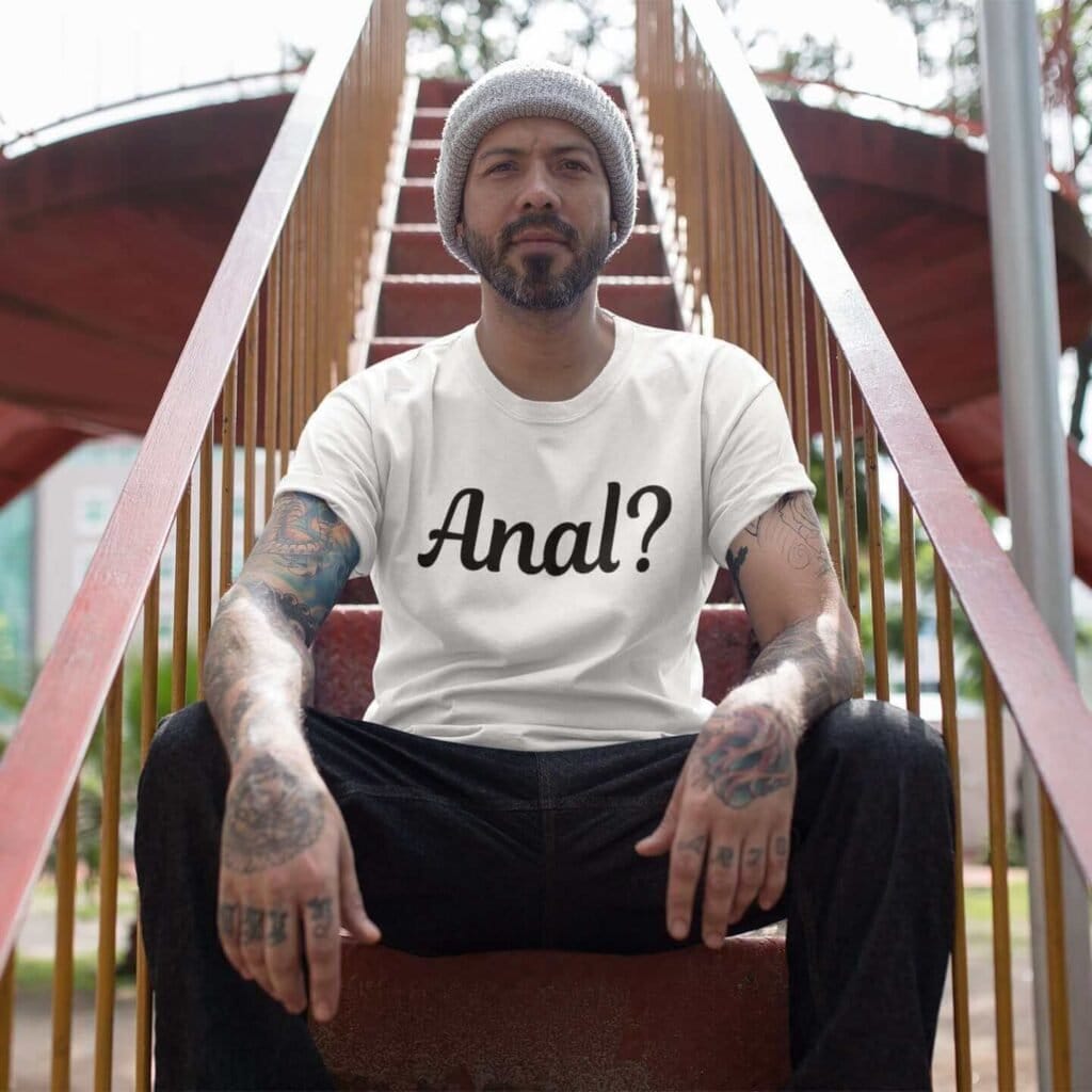 Man wearing a white t-shirt with the text 'Anal?' printed on the front.
