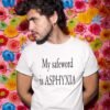 Man wearing a white t-shirt with the text 'My safeword is asphyxia' printed on the front.