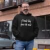 Man wearing a black hoodie sweatshirt with the text 'A bound body frees the mind' printed on the front.