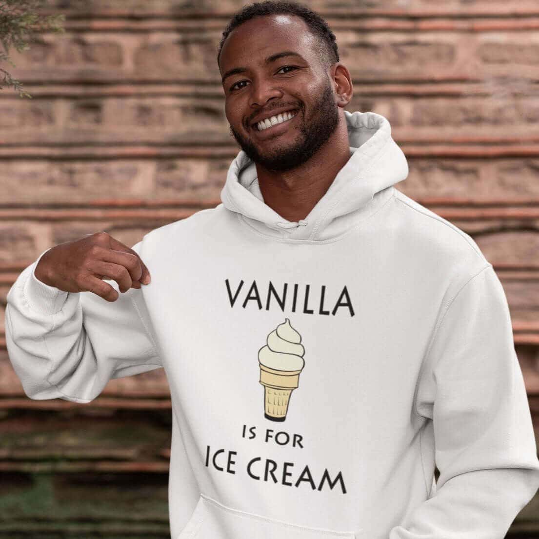 Man wearing a white hoodie sweatshirt with an image of a vanilla ice cream cone and the text 'Vanilla is for ice cream' printed on the front.