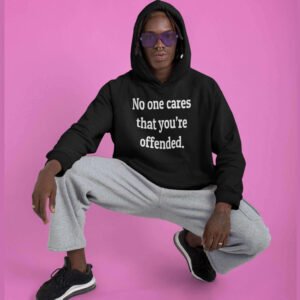 Man wearing a black hoodie sweatshirt with the text 'No one cares that you're offended.' printed on the front.