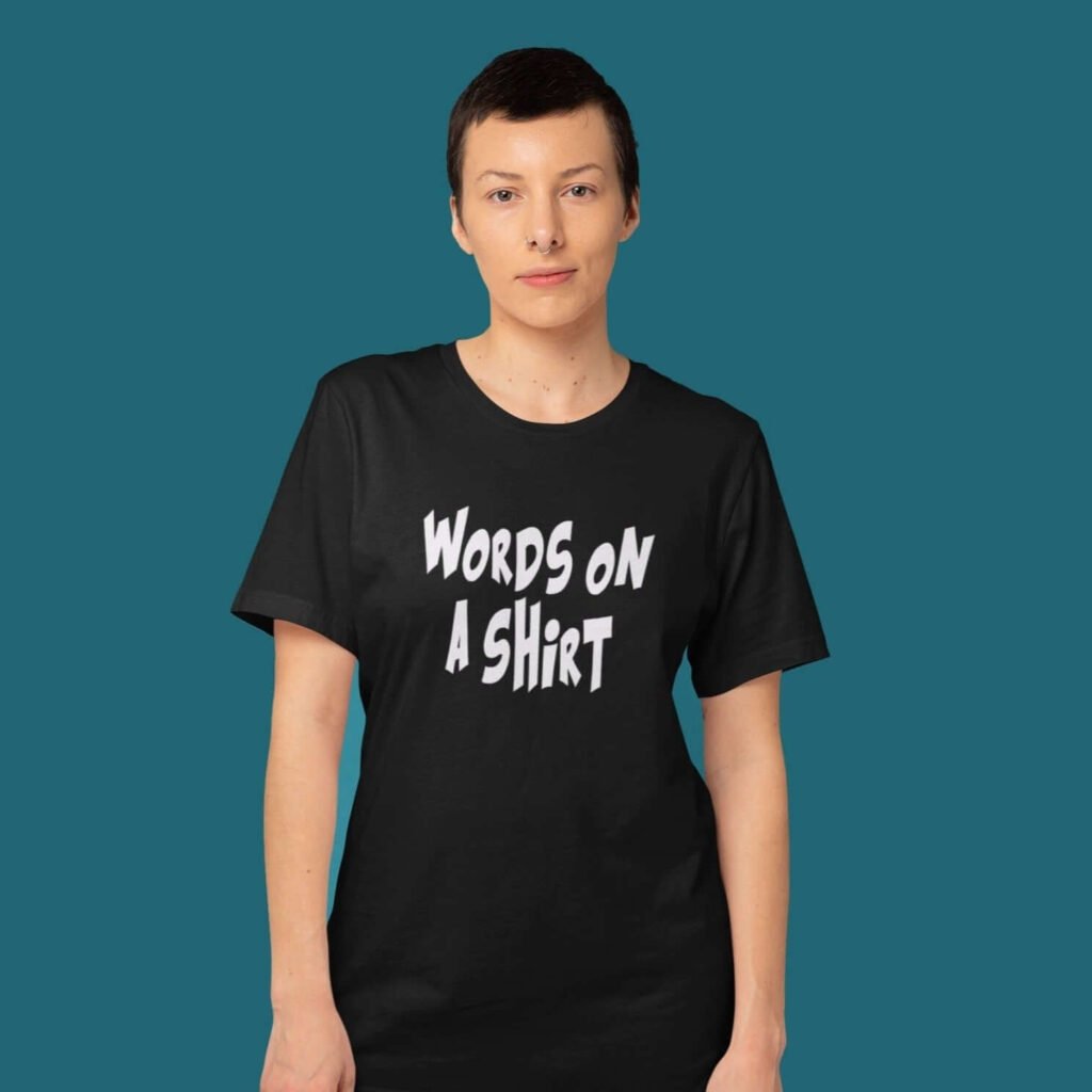 Woman wearing a black t-shirt with the text 'Words on a shirt' printed on the front.