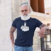 Grey haired bearded man wearing navy blue t-shirt with an image of middle finger silhouette printed on the front.