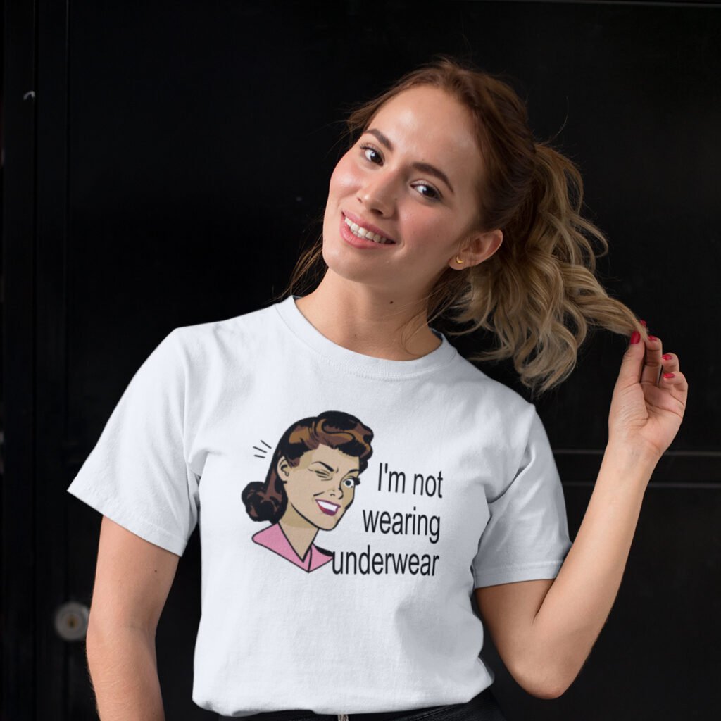 Woman wearing a white t-shirt with an image of a retro woman and the text 'I'm not wearing underwear' printed on the front.