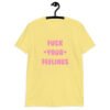 Cornsilk yellow t-shirt with the text 'Fuck your feelings' printed on the front in pink. There are cute pink hearts next to the words.