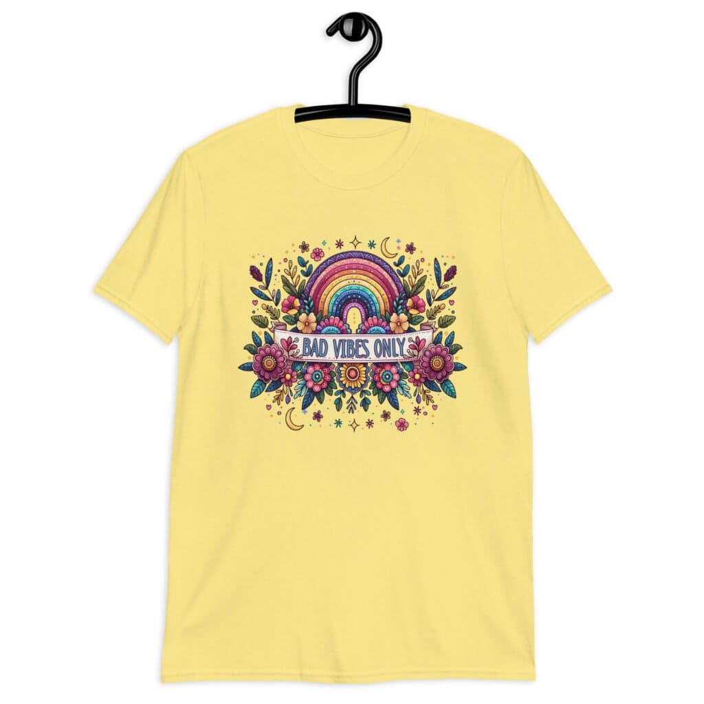 Cornsilk yellow t-shirt with colorful boho floral design and the test 'Bad vibes only' printed on the front.