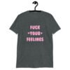 Dark heather grey t-shirt with the text 'Fuck your feelings' printed on the front in pink. There are cute pink hearts next to the words.