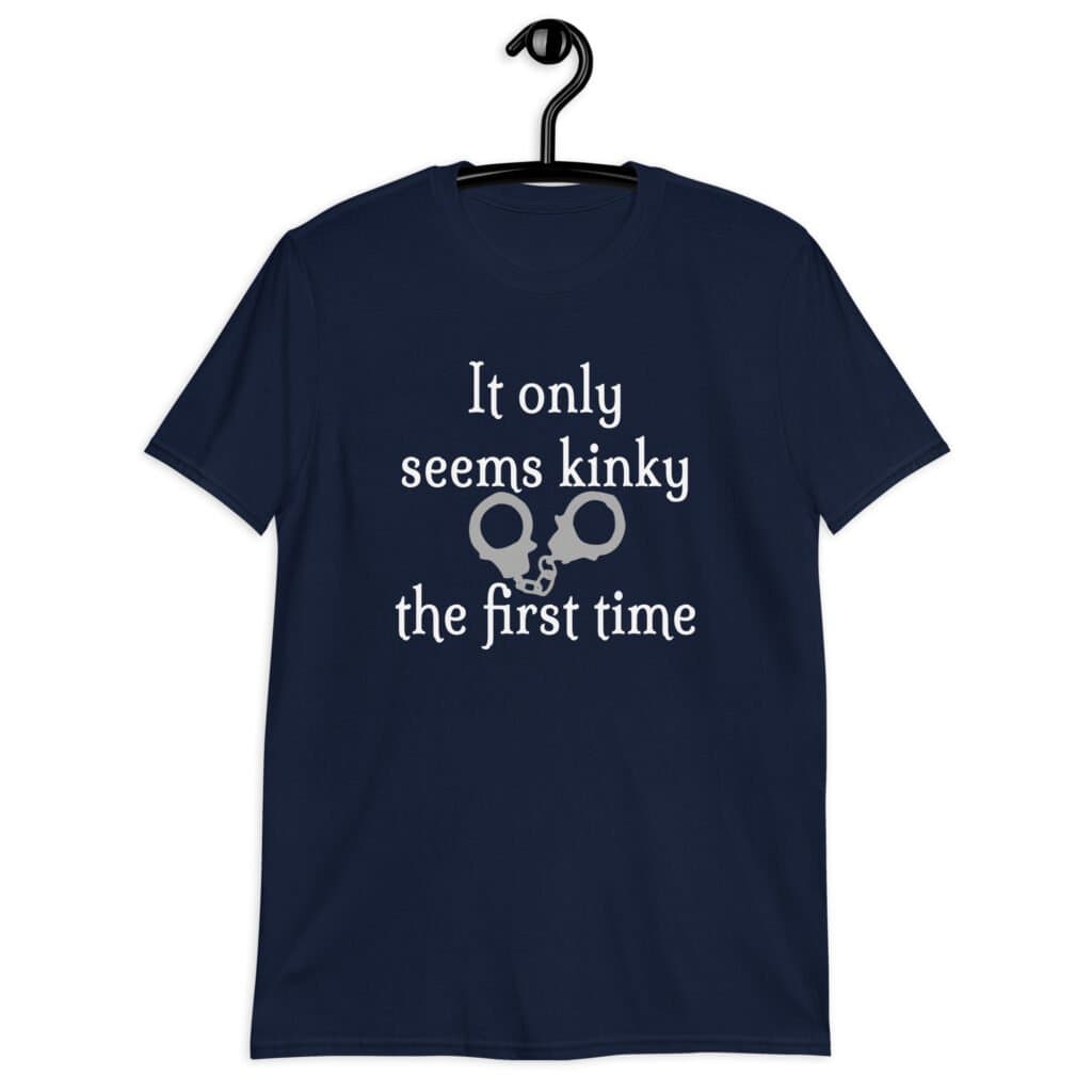 Navy blue t-shirt with an image of handcuffs and the text 'It only seems kinky the first time' printed on the front.