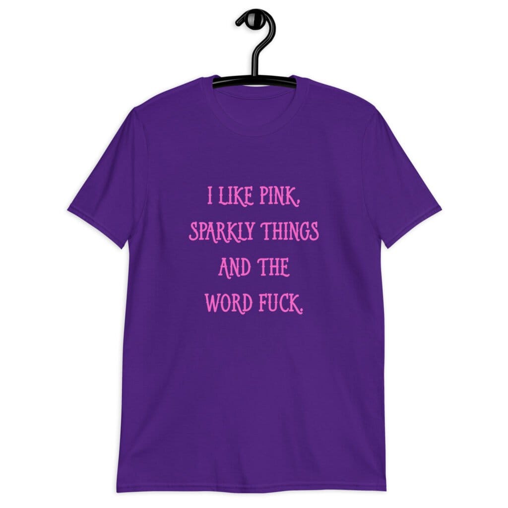 Purple t-shirt with the text 'I like pink, sparkly things and the word fuck.' printed on the front in pink.