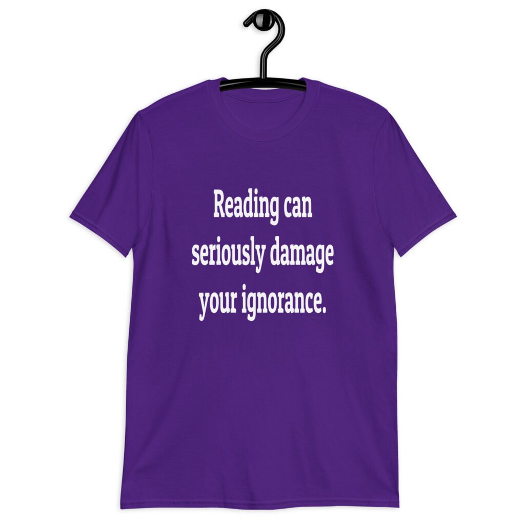 Purple t-shirt with the text 'Reading can seriously damage your ignorance.' printed on the front.