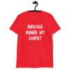 Red t-shirt with the text 'Bukkake ruined my carpet' in drippy font printed on the front.