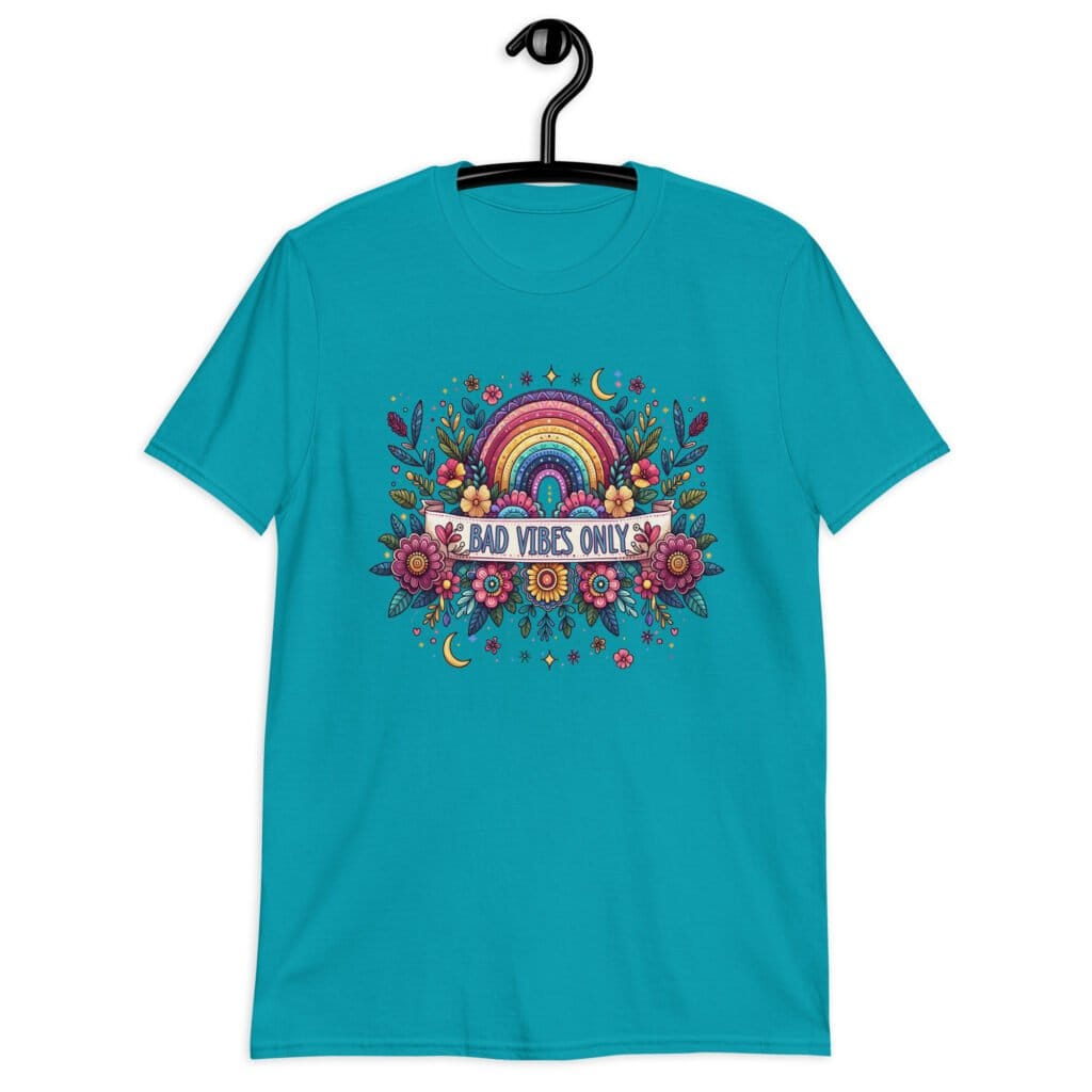 Tropical blue t-shirt with colorful boho floral design and the test 'Bad vibes only' printed on the front.