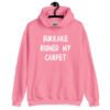 Azalea pink hoodie sweatshirt with the text 'Bukkake ruined my carpet' in drippy font printed on the front.