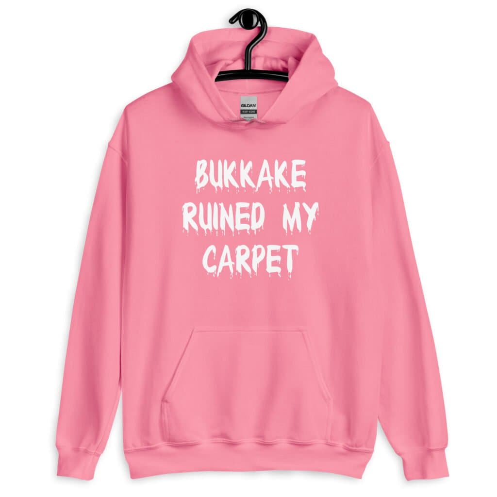 Azalea pink hoodie sweatshirt with the text 'Bukkake ruined my carpet' in drippy font printed on the front.