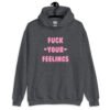 Dark heather grey hoodie sweatshirt with the text 'Fuck your feelings' printed on the front in pink. There are cute pink hearts next to the words.