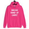Heliconia pink hoodie sweatshirt with the text 'Bukkake ruined my carpet' in drippy font printed on the front.
