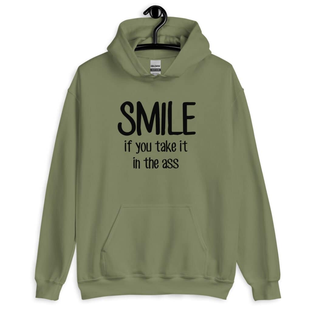 Military green hoodie sweatshirt with the text 'Smile if you take it in the ass' printed on the front. The word 'smile' is large and the words 'take it in the ass' are much smaller.