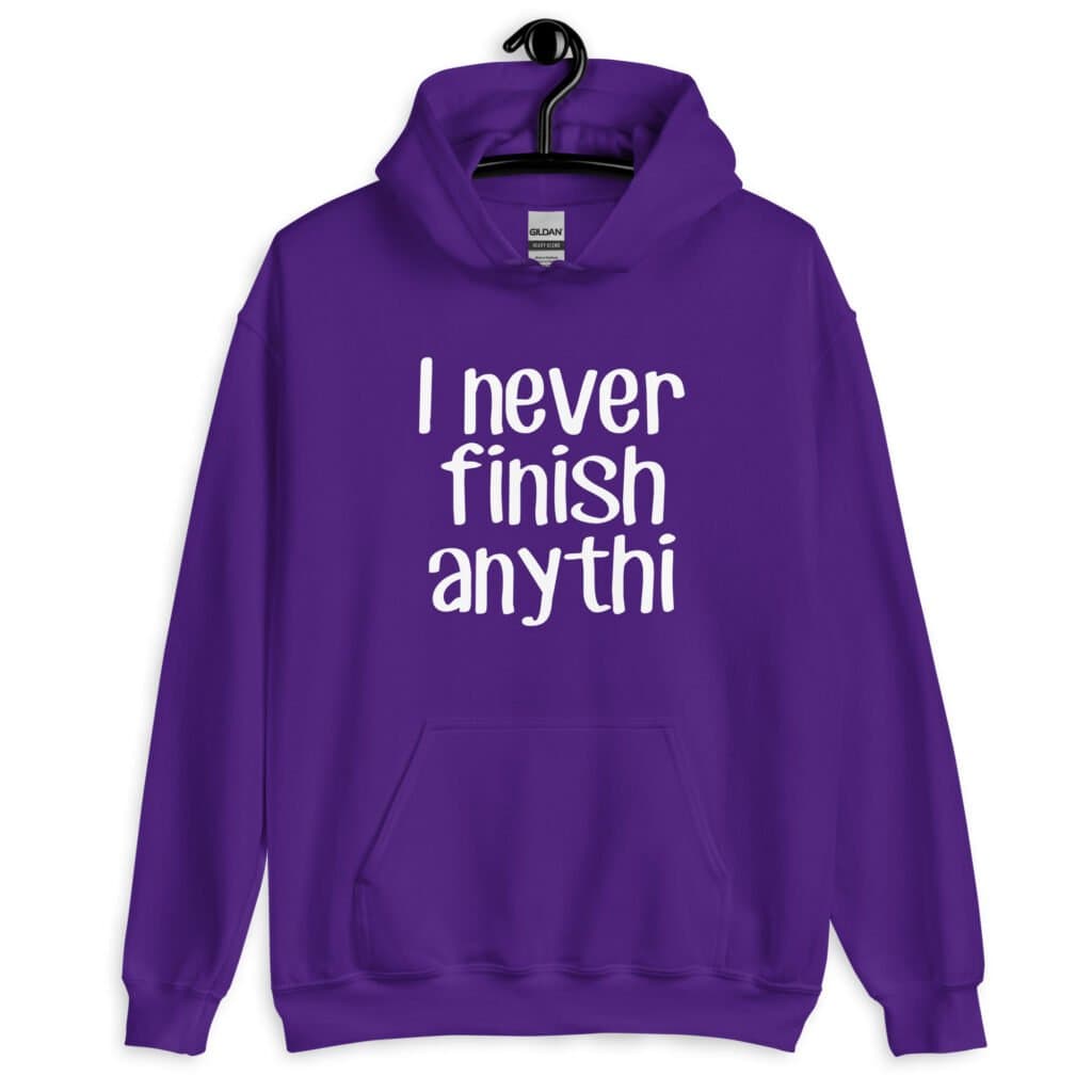 Purple hoodie sweatshirt with the text 'I never finish anyth' printed on the front.