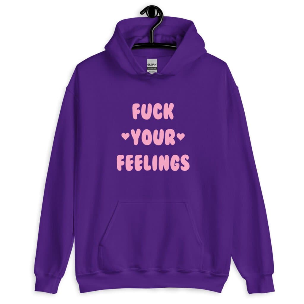 Purple hoodie sweatshirt with the text 'Fuck your feelings' printed on the front in pink. There are cute pink hearts next to the words.