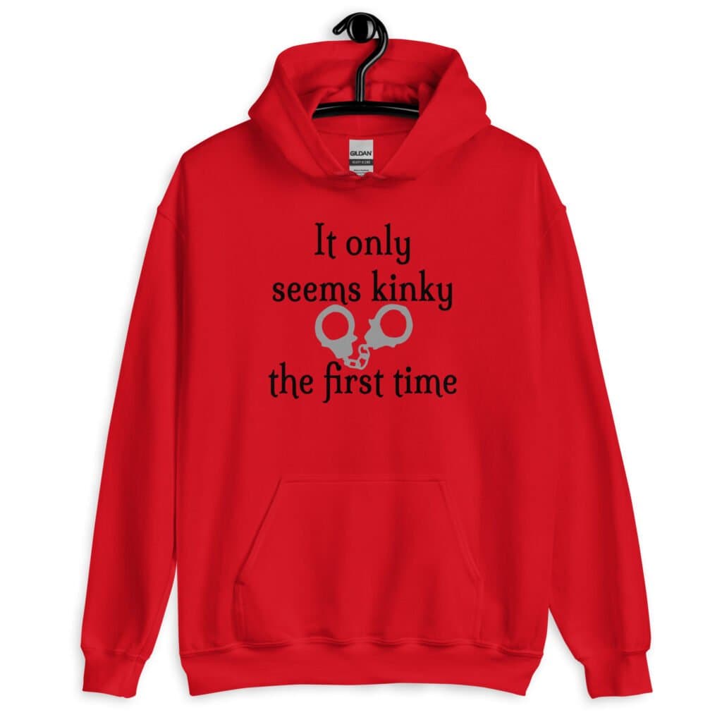Red hoodie sweatshirt with an image of handcuffs and the text 'It only seems kinky the first time' printed on the front.