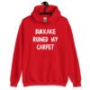 Red hoodie sweatshirt with the text 'Bukkake ruined my carpet' in drippy font printed on the front.