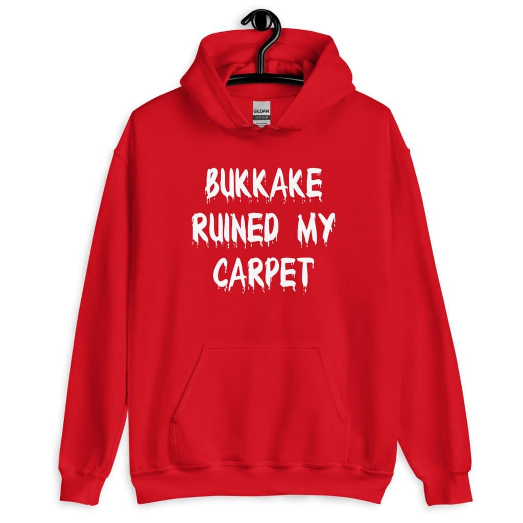Red hoodie sweatshirt with the text 'Bukkake ruined my carpet' in drippy font printed on the front.