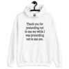 White hoodie sweatshirt with the text 'Thank you for pretending not to see me while I was pretending not to see you.' printed on the front.