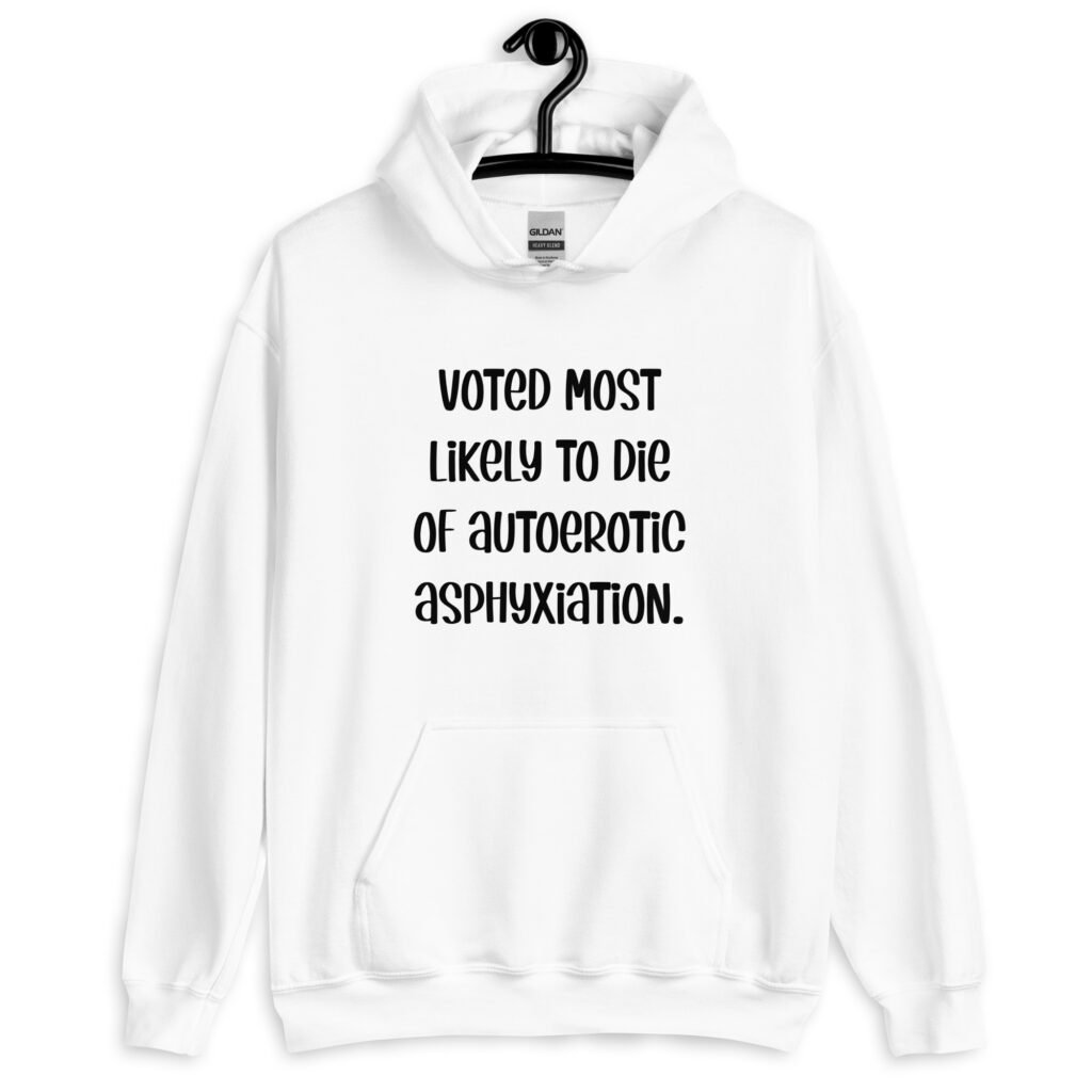 White hoodie sweatshirt with the hood up covering some of her face. The hoodie has the text 'Voted most likely to die of autoerotic asphyxiation.' printed on the front.