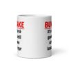 White ceramic mug with the text 'Bukkake. It's all fun & games until someone loses an eye' printed on both sides.
