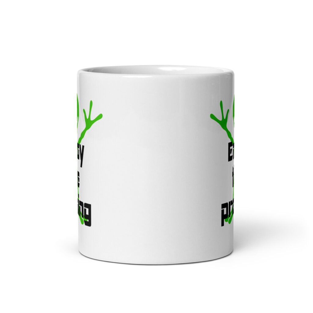 White ceramic coffee mug with an image of a green alien and the text 'Enjoy the probing' printed on both sides of the mug.