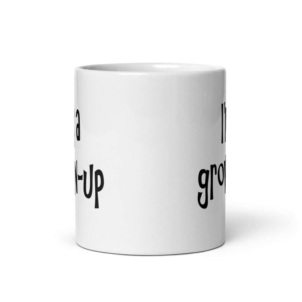 White ceramic coffee mug with the text 'I'm a grown-up' printed on both sides.