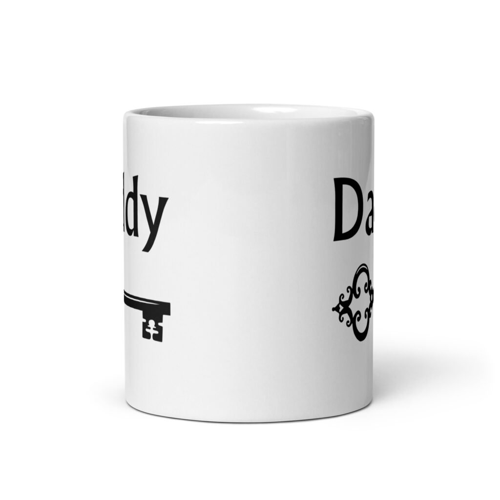White ceramic coffee mug with an image of a key and the word 'Daddy' printed on both sides.