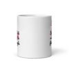 White ceramic coffee mug with an image of a flamingo and the text 'Single & ready to flamingle' printed on both sides.