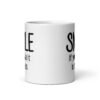 White ceramic mug with the text 'Smile if you take it in the ass' printed on both sides. The word 'smile' is large and the words 'take it in the ass' are much smaller.