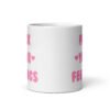 White ceramic coffee mug with the text 'Fuck your feelings' printed on both sides in pink. There are cute pink hearts next to the words.