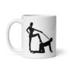 White ceramic bdsm power dynamic mug with the image of a silhouette of a man on his hands and knees and a dominatrix holding his leash printed on both sides.