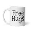 White ceramic coffee mug with the text 'Free Hugs' printed on both sides.