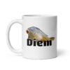 White ceramic coffee mug with a funny pun graphic of a carp fish and the word Diem printed underneath. The graphic is printed on both sides of the mug.