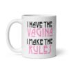 White ceramic coffee mug with the text 'I have the vagina. I make the rules' printed on both sides.