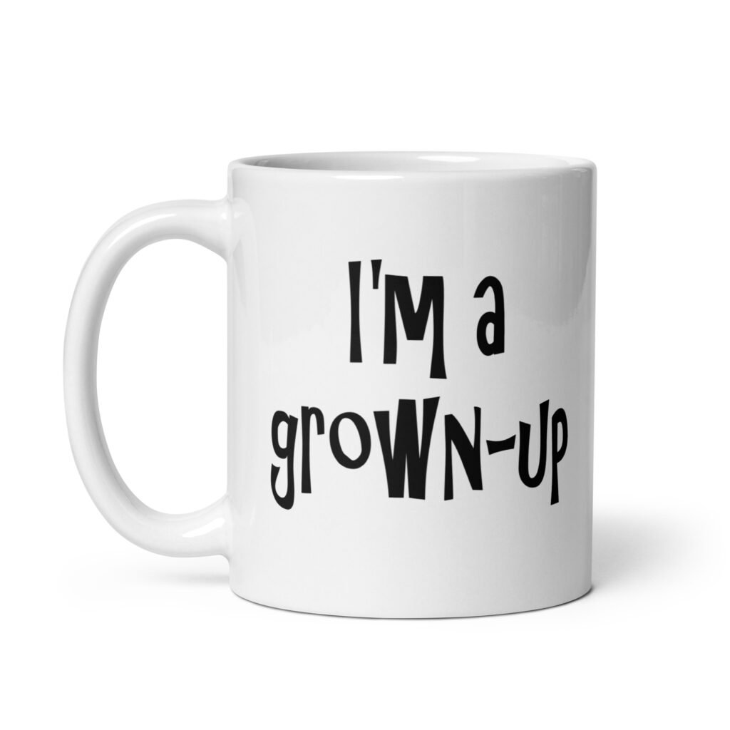 White ceramic coffee mug with the text 'I'm a grown-up' printed on both sides.