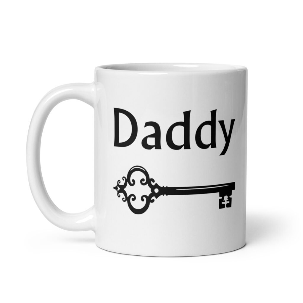 White ceramic coffee mug with an image of a key and the word 'Daddy' printed on both sides.