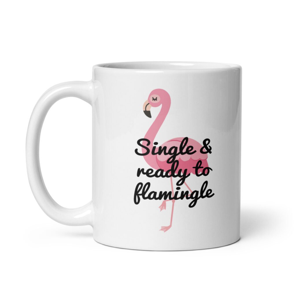 White ceramic coffee mug with an image of a flamingo and the text 'Single & ready to flamingle' printed on both sides.