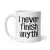 White ceramic coffee mug with the text 'I never finish anyth' printed on both sides.