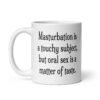 White ceramic coffee mug with the suggestive text 'Masturbation is a touchy subject, but oral sex is a matter of taste.' printed on both sides.
