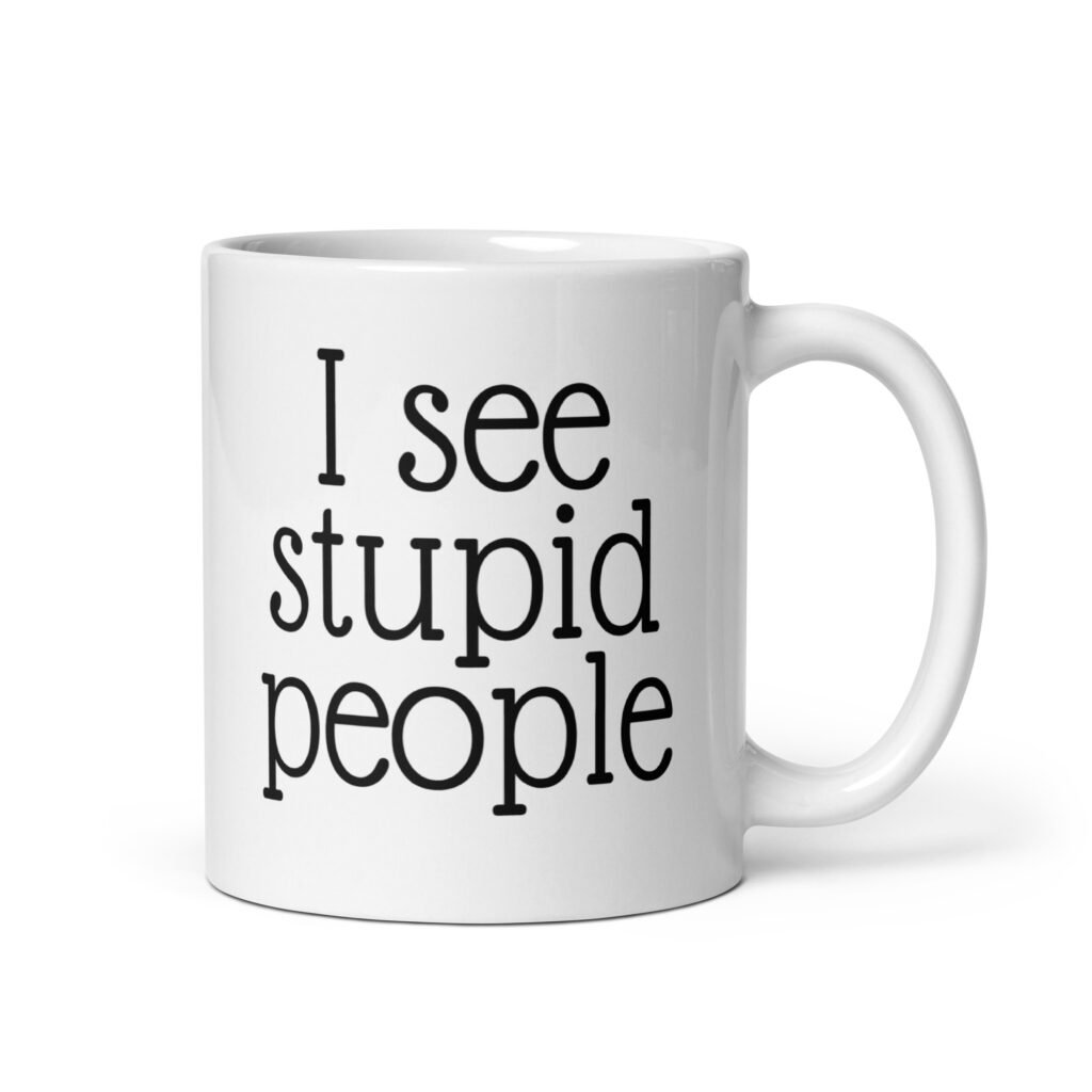 White ceramic coffee mug with the text 'I see stupid people' printed on both sides.