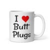 White ceramic coffee mug with the text 'I ❤️ Butt Plugs' printed on both sides.