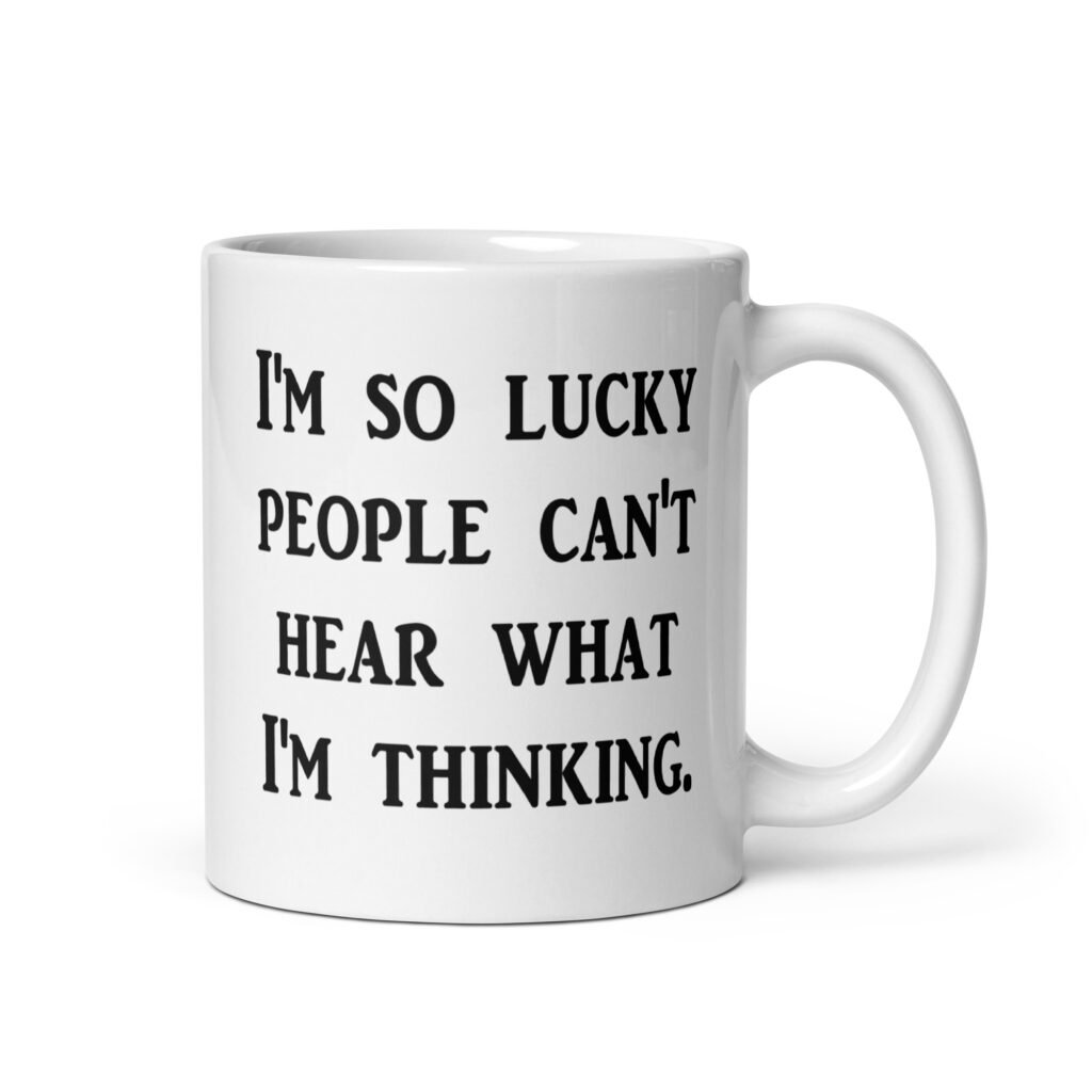 White ceramic coffee mug with the text 'I'm so lucky people can't hear what I'm thinking' printed on both sides.